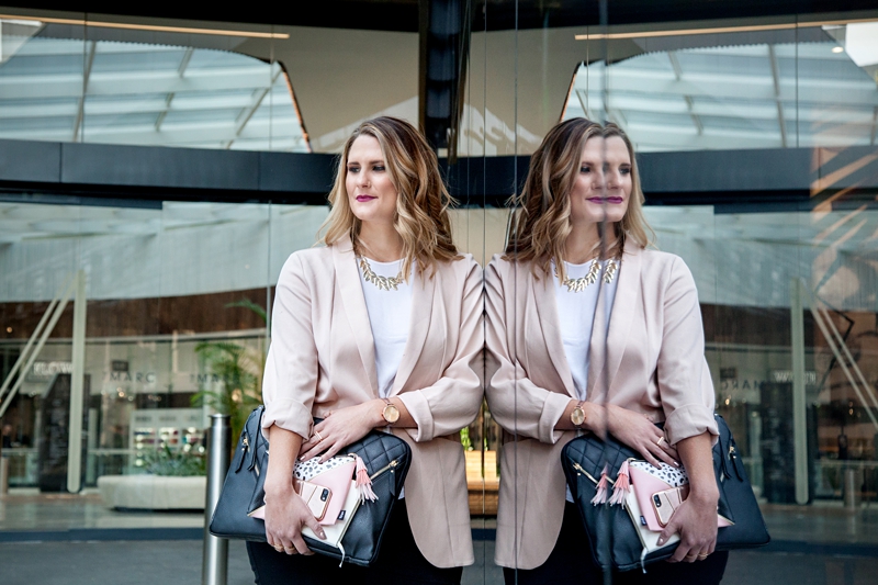 Business woman reflection in shop window