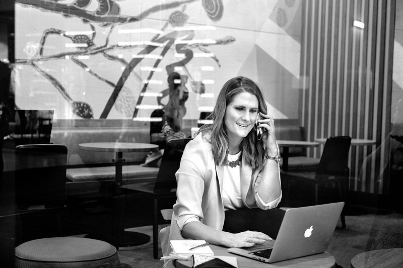 Business woman Pam Newman on the phone at Starbucks