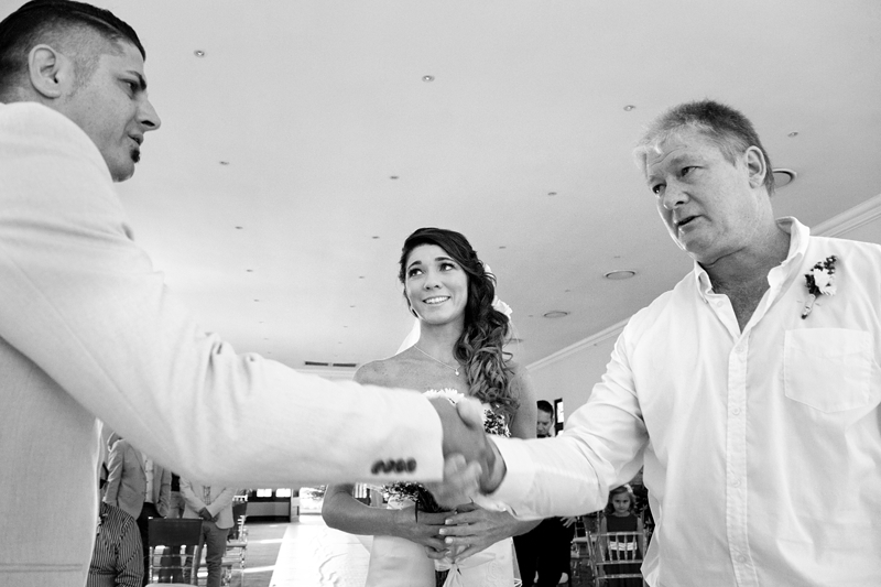 Bride's dad shaking hands with the groom, during ceremony at Estuary Hotel, Port Edward.