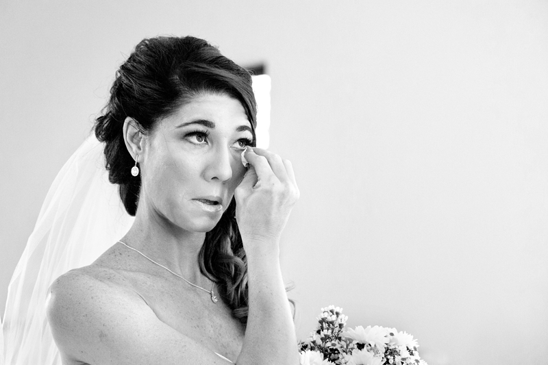Bride wiping away her tears during the ceremony at Estuary Hotel, Port Edward.
