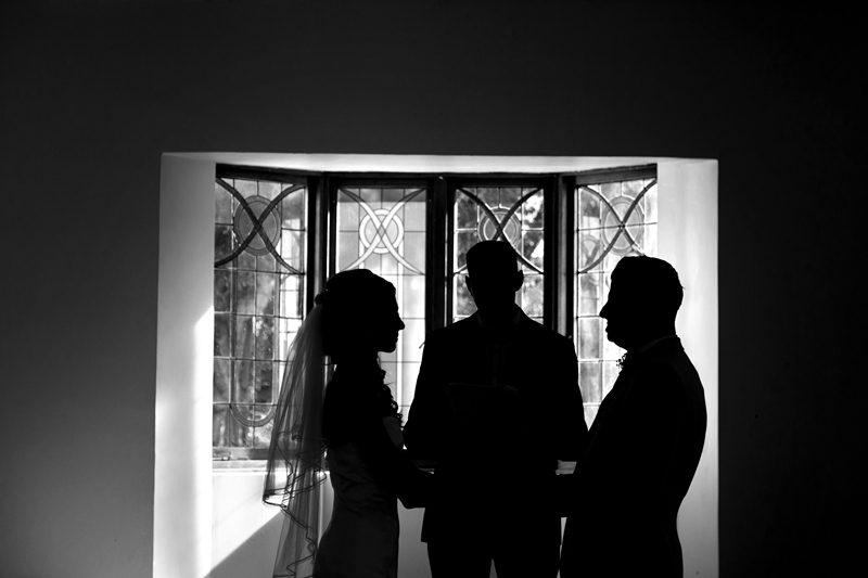 Silhouette of bride and groom during ceremony at Estuary Hotel, Port Edward.
