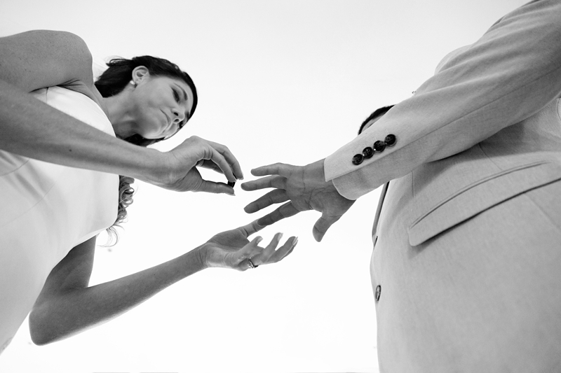Bride placing ring onto grooms finger at Estuary Hotel, Port Edward.