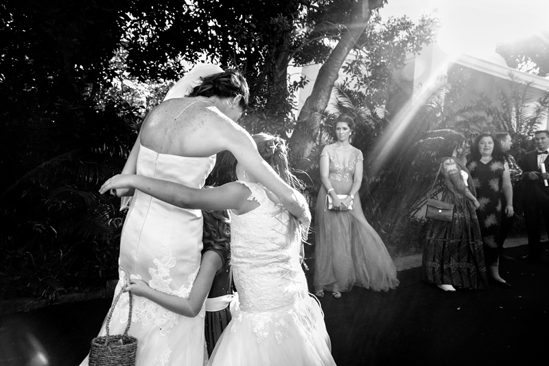 Children hugging bride at wedding at Estuary Hotel, Port Edward.