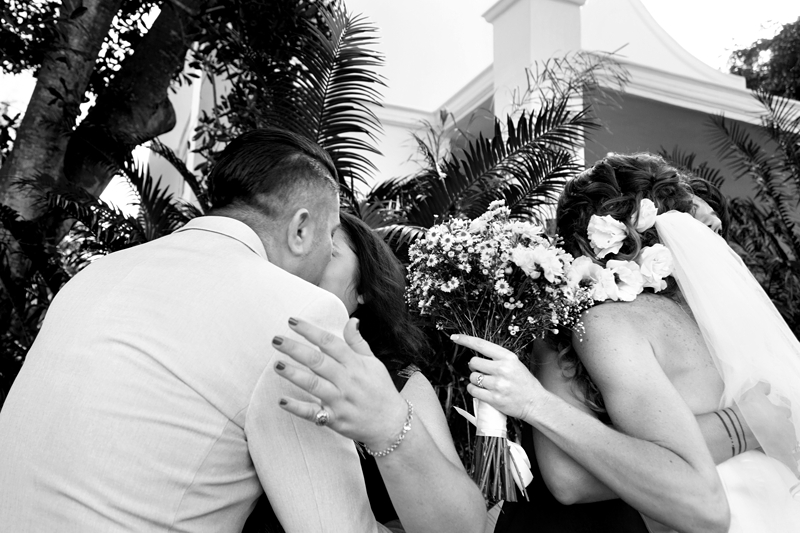 Guests hugging bride and groom at wedding at Estuary Hotel, Port Edward.