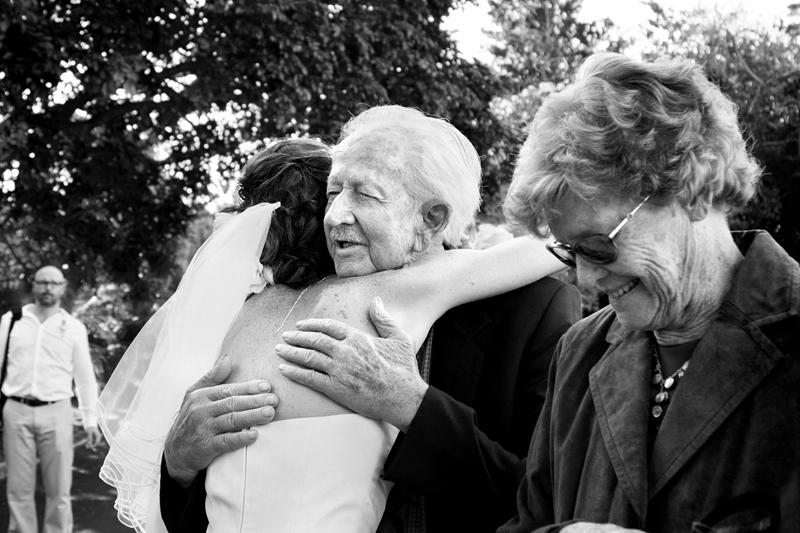 Granddad hugging bride at wedding at Estuary Hotel, Port Edward.