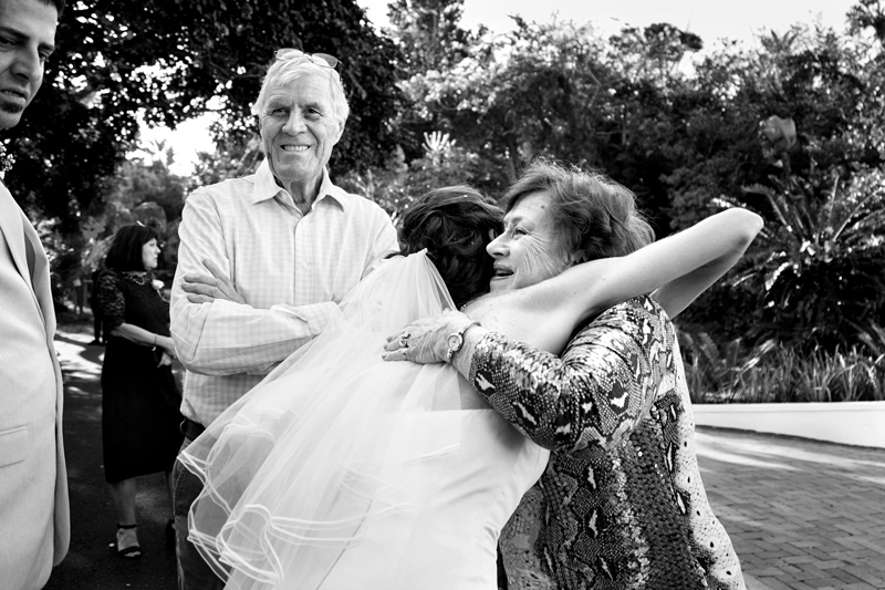 Guest hugging bride at wedding at Estuary Hotel, Port Edward.
