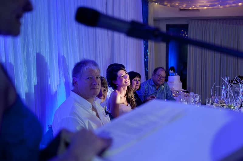 Bride laughing during speeches at wedding held at the Estuary Hotel, Port Edward