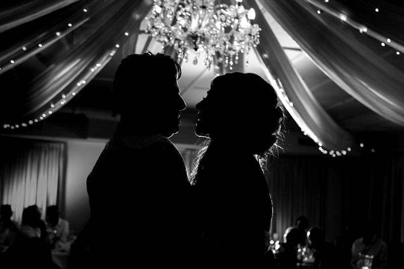 Silhouette of bride and groom during their first dance at the Estuary Hotel