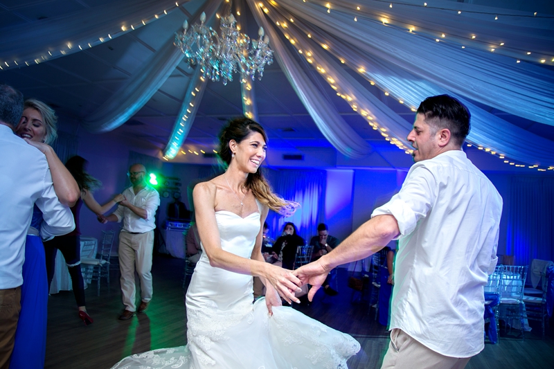 Groom twirling his bride at their wedding held at Estuary Hotel