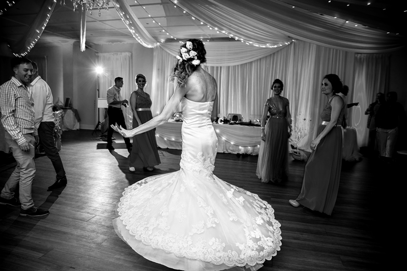 Bride swirling her white dress at the Estuary Hotel