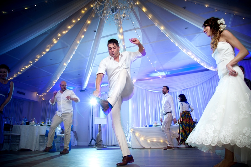 Groom touching his toes during dancing at Estuary Hotel in Port Edward