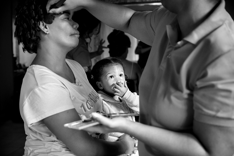 Black and white photograph, child picking nose at Valverde Eco Hotel.