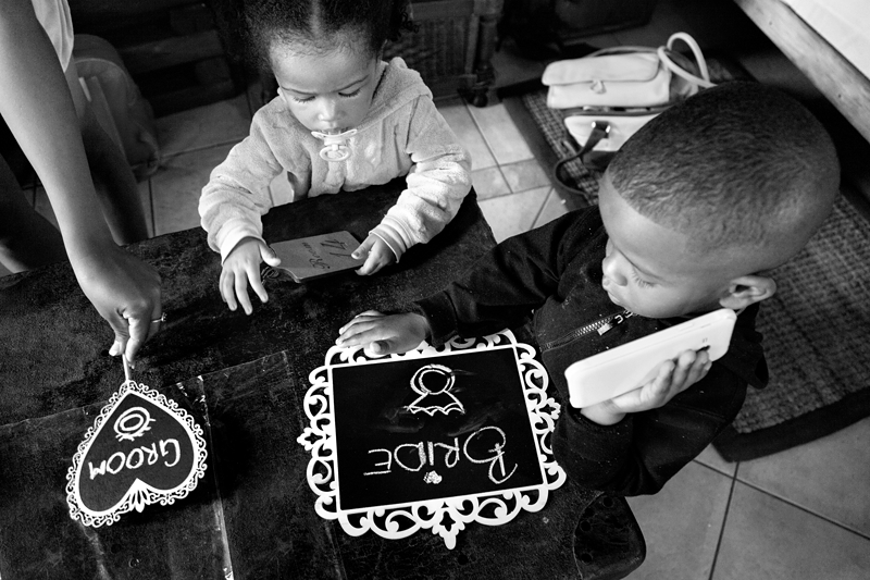 Black and white photograph, children drawing at Valverde Eco Hotel.
