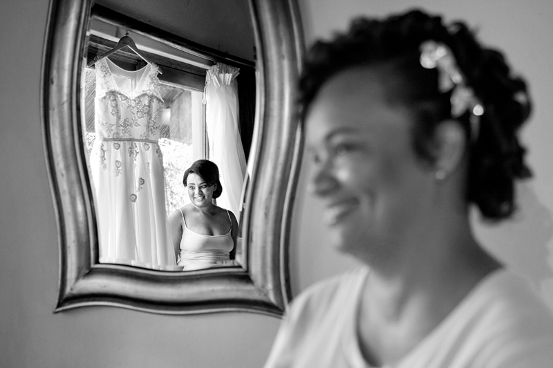 Black and white photograph, bride with dress reflection at Valverde Eco Hotel.