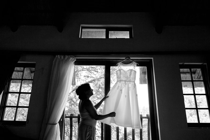Black and white photograph, silhouette of bride and wedding dress at Valverde Eco Hotel.