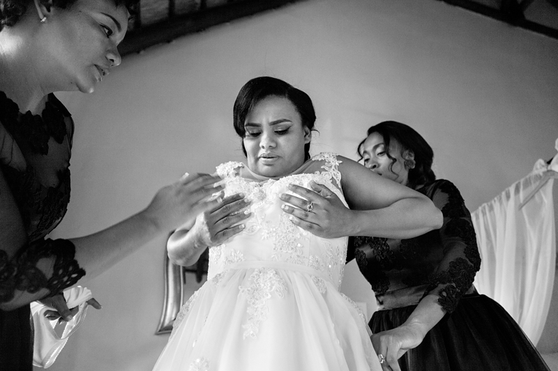 Black and white photograph, bride lifting her boobs at Valverde Eco Hotel.