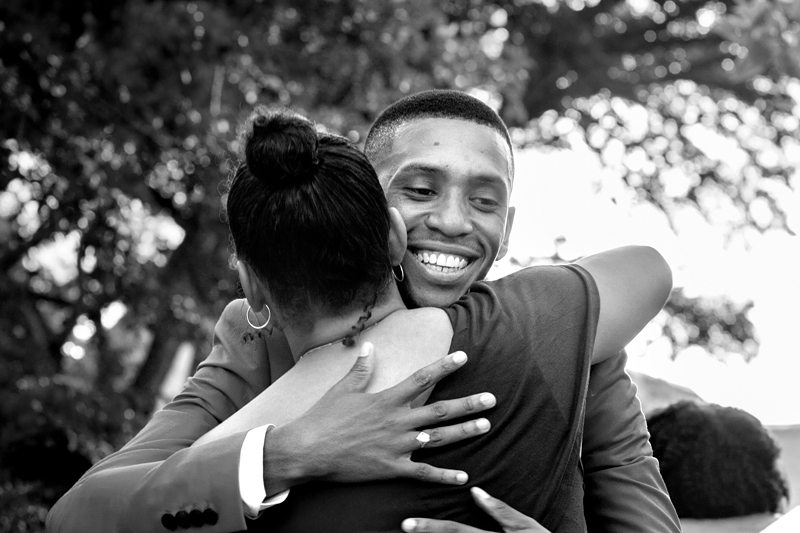 Black and white photograph, hugging during wedding at Valverde Eco Hotel.