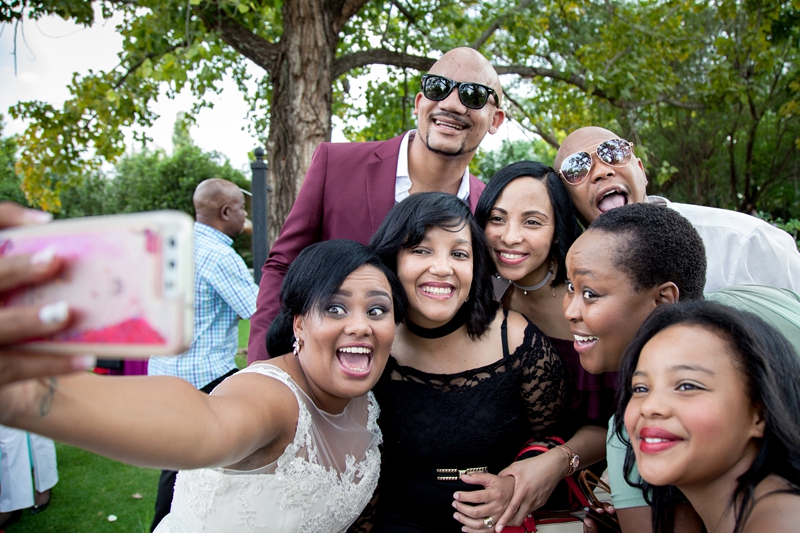 Bride taking selfie with guests  at Valverde Eco Hotel.