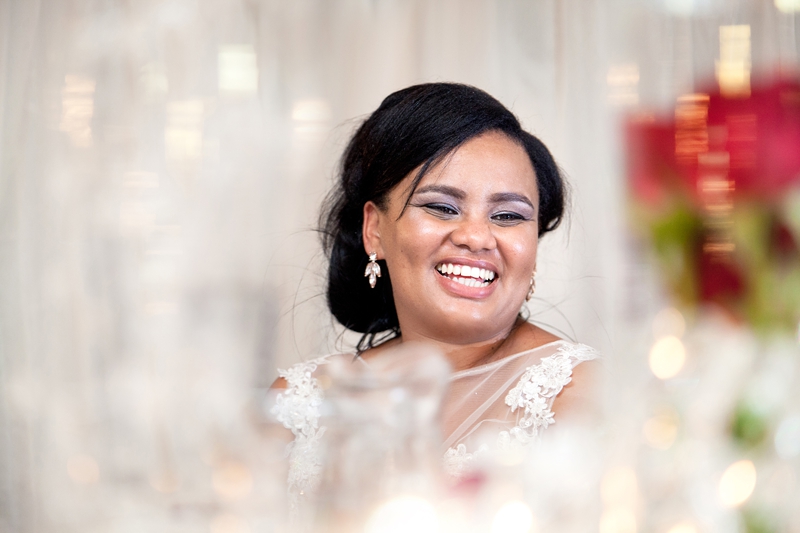 Bride laughing during speeches at Valverde Eco Hotel.