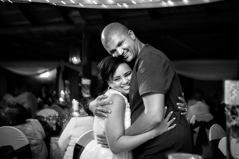 Black and white photograph, hugging at reception at Valverde Eco Hotel.