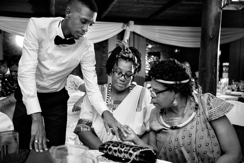 Black and white photograph, groom with guests at Valverde Eco Hotel.