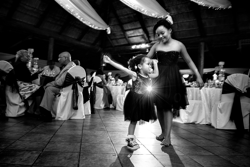 Black and white photograph, kids dancing at Valverde Eco Hotel.