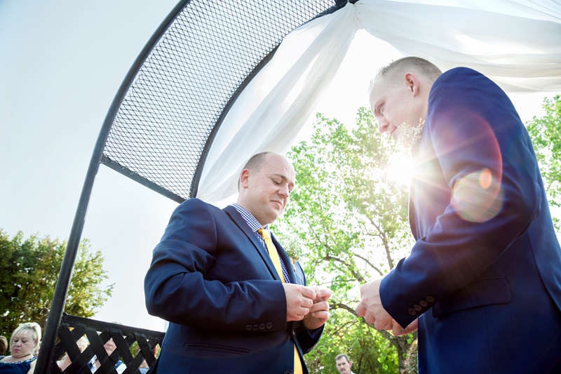 Groom looking down at ring during ceremony at Valverde Eco Hotel.
