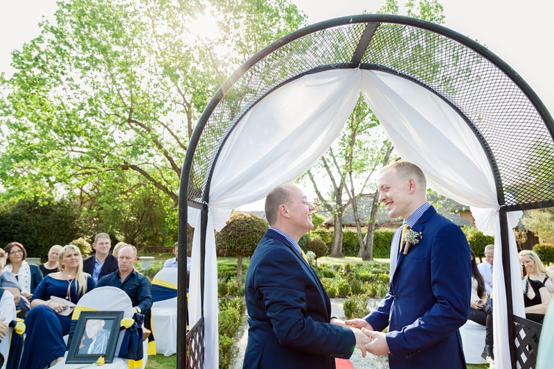 Grooms laughing during ceremony at Valverde Eco Hotel.