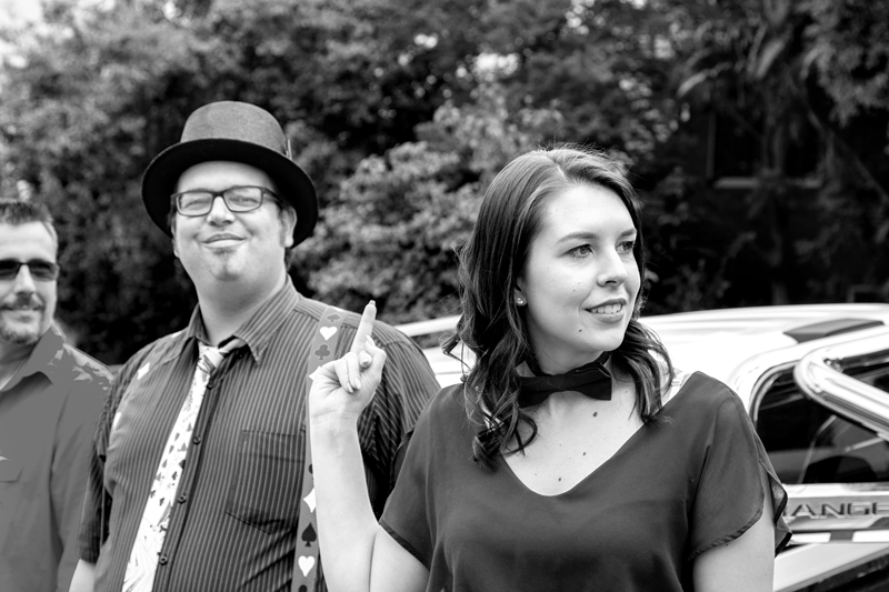 Wedding guest pulling a zap sign at the groom.