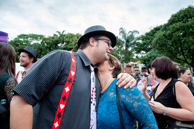 Guests hugging at wedding ceremony