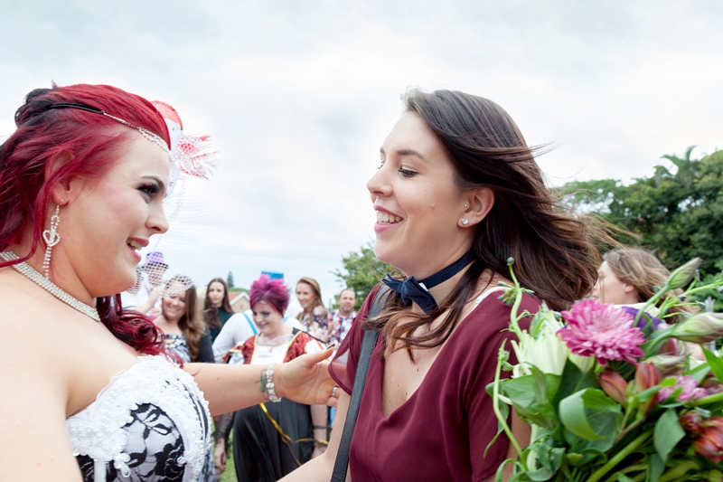 Guests hugging at wedding ceremony