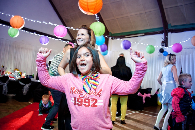 Children dancing at Alice in Wonderland themed wedding.