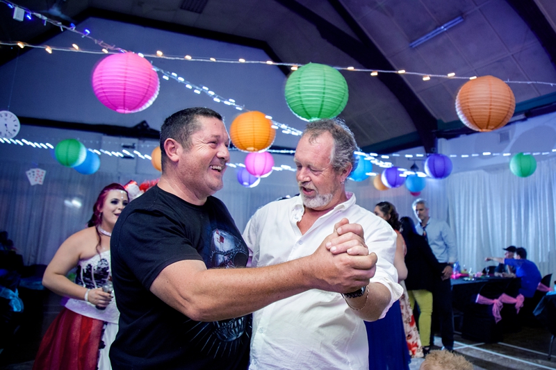 Guests dancing at Alice in Wonderland themed wedding.