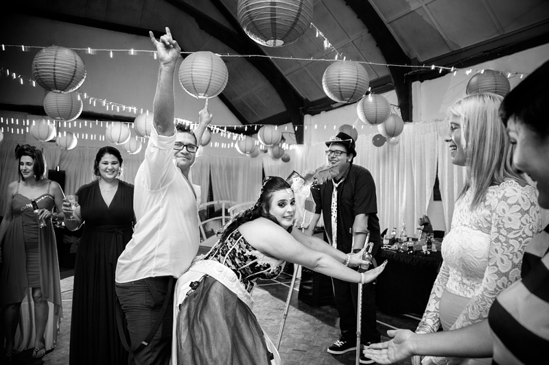 Guests dancing at Alice in Wonderland themed wedding.