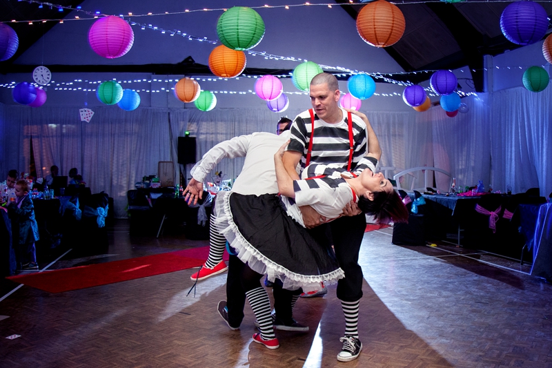 Tweedledee and Tweedledum dancing at Alice in Wonderland themed wedding.