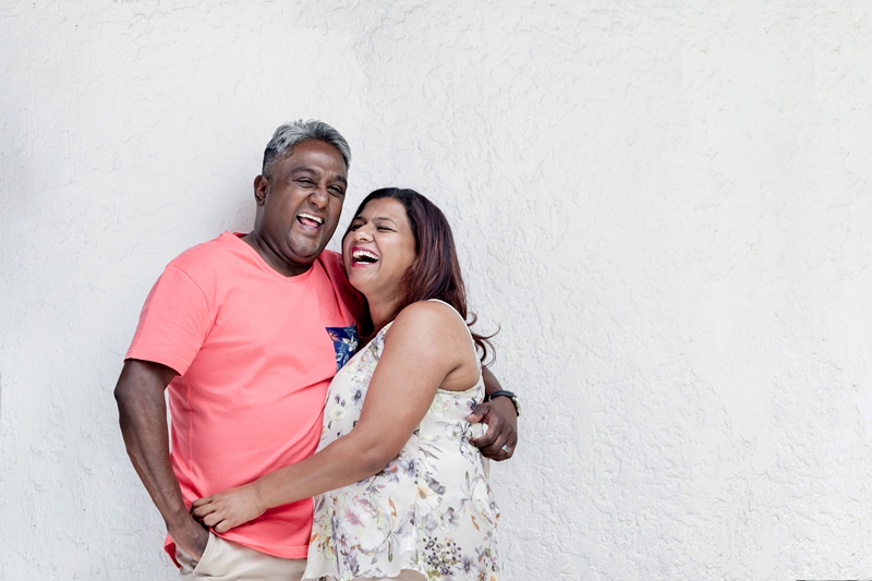 Indian couple laughing.