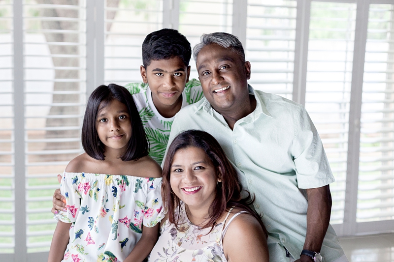 Portrait of Indian family in their home.