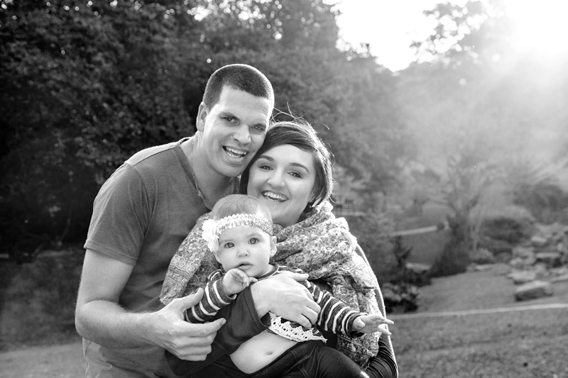 Parents holding girl toddler at Japanese Gardens, Pinetown.