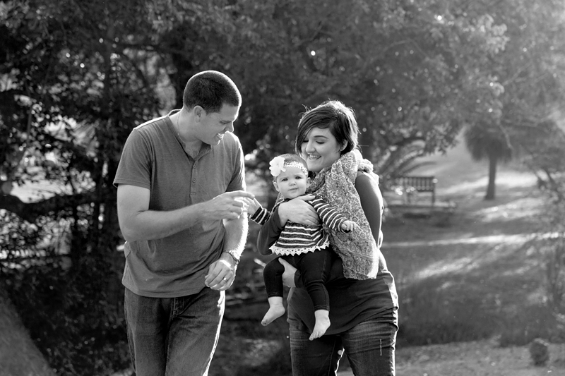 Girl toddler pulling a funny face while walking with parents, at Japanese Gardens, Pinetown.