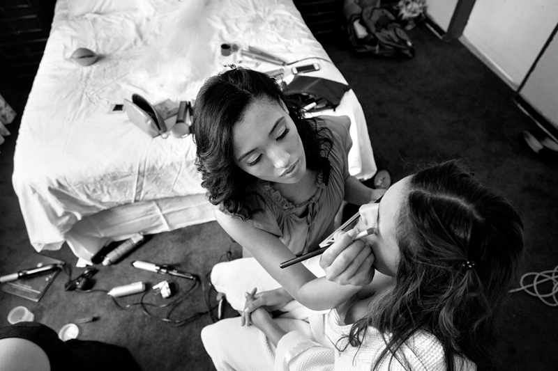 Bride doing bridesmaids makeup.