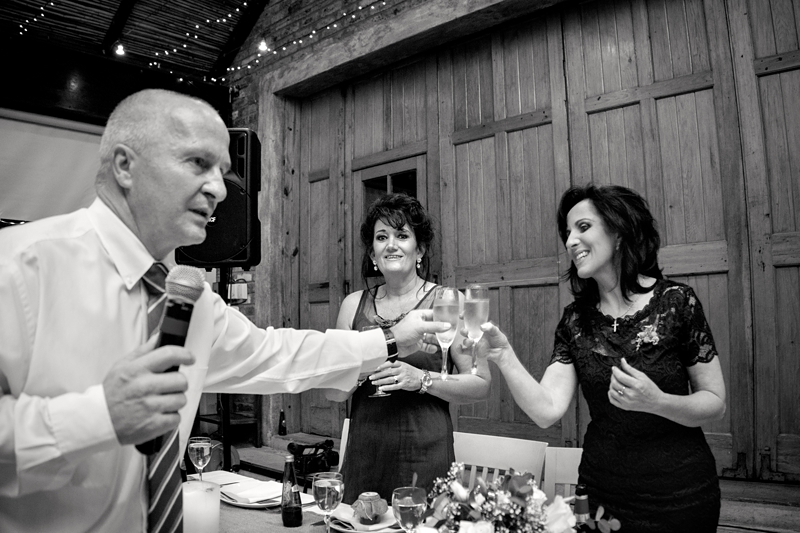 Guests toasting with champagne at wedding reception, at Leafy Green Cafe.