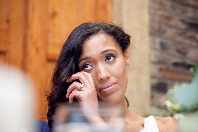 Bride wiping away her tears during speeches at Leafy green Cafe.
