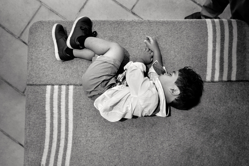 Child sleeping on the table, during wedding reception, at Leafy Green Cafe.