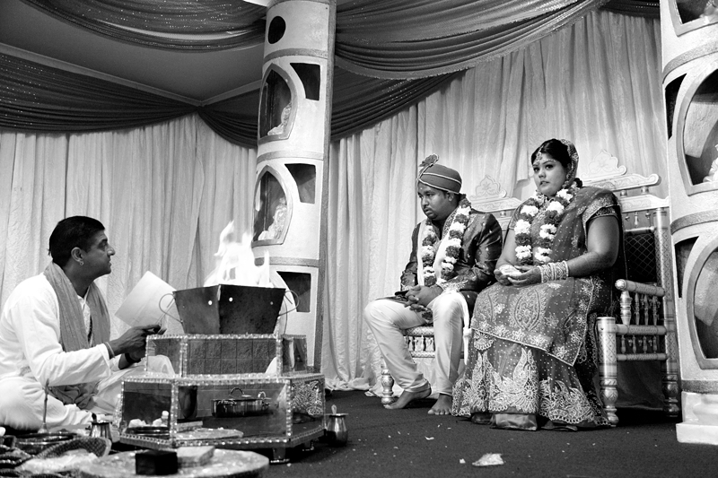 Bride and groom during Hindu ceremony at Shree Radhe Shyam Mandir.
