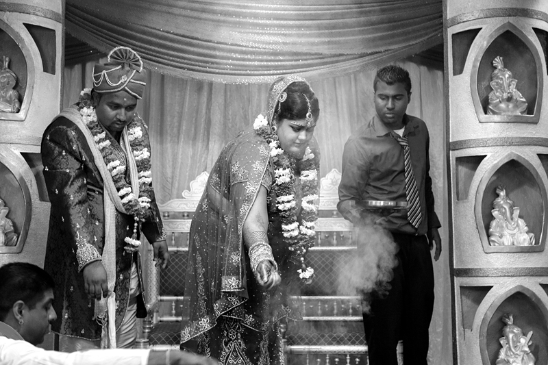 Bride and groom during Hindu ceremony at Shree Radhe Shyam Mandir.