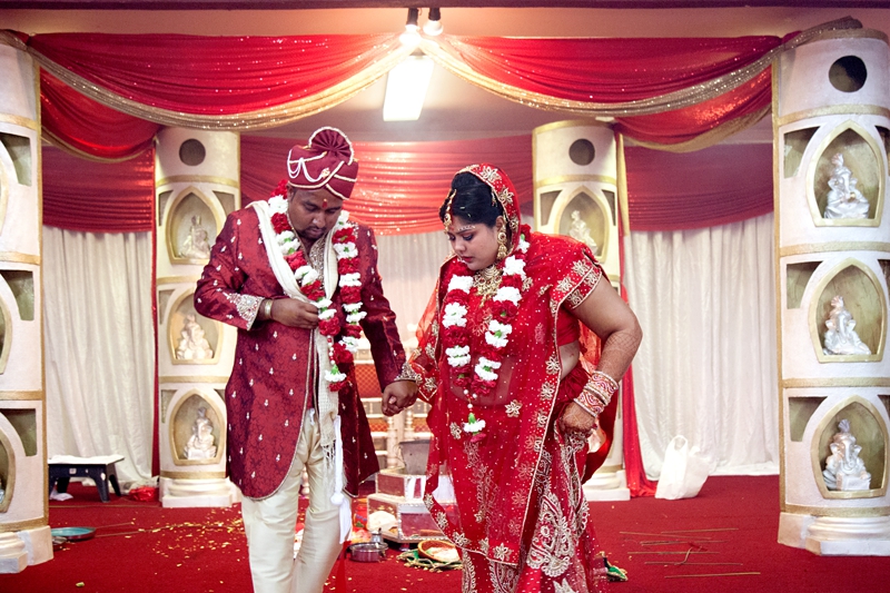 Bride and groom during Hindu ceremony at Shree Radhe Shyam Mandir.