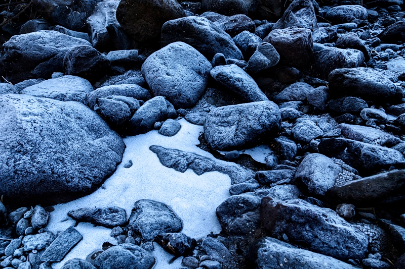 Black stones with frost